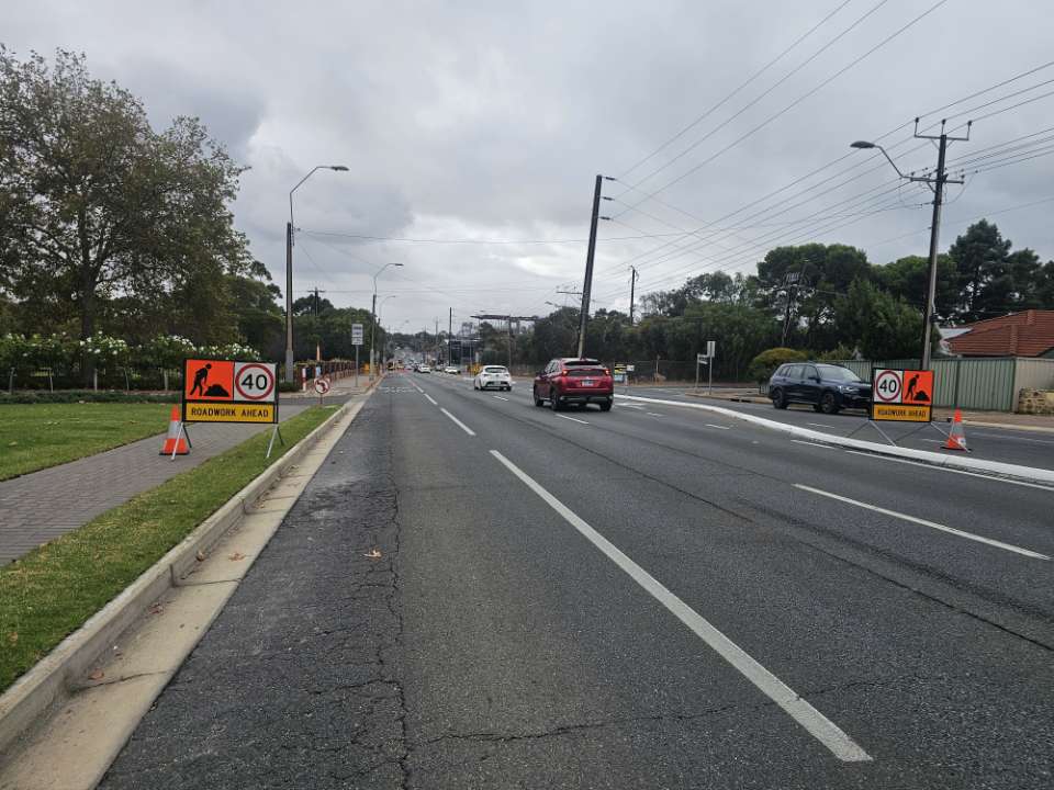 Roadwork ahead signage on a suburban street